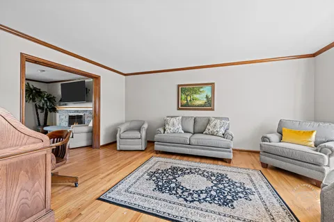 a living room with furniture and a rug