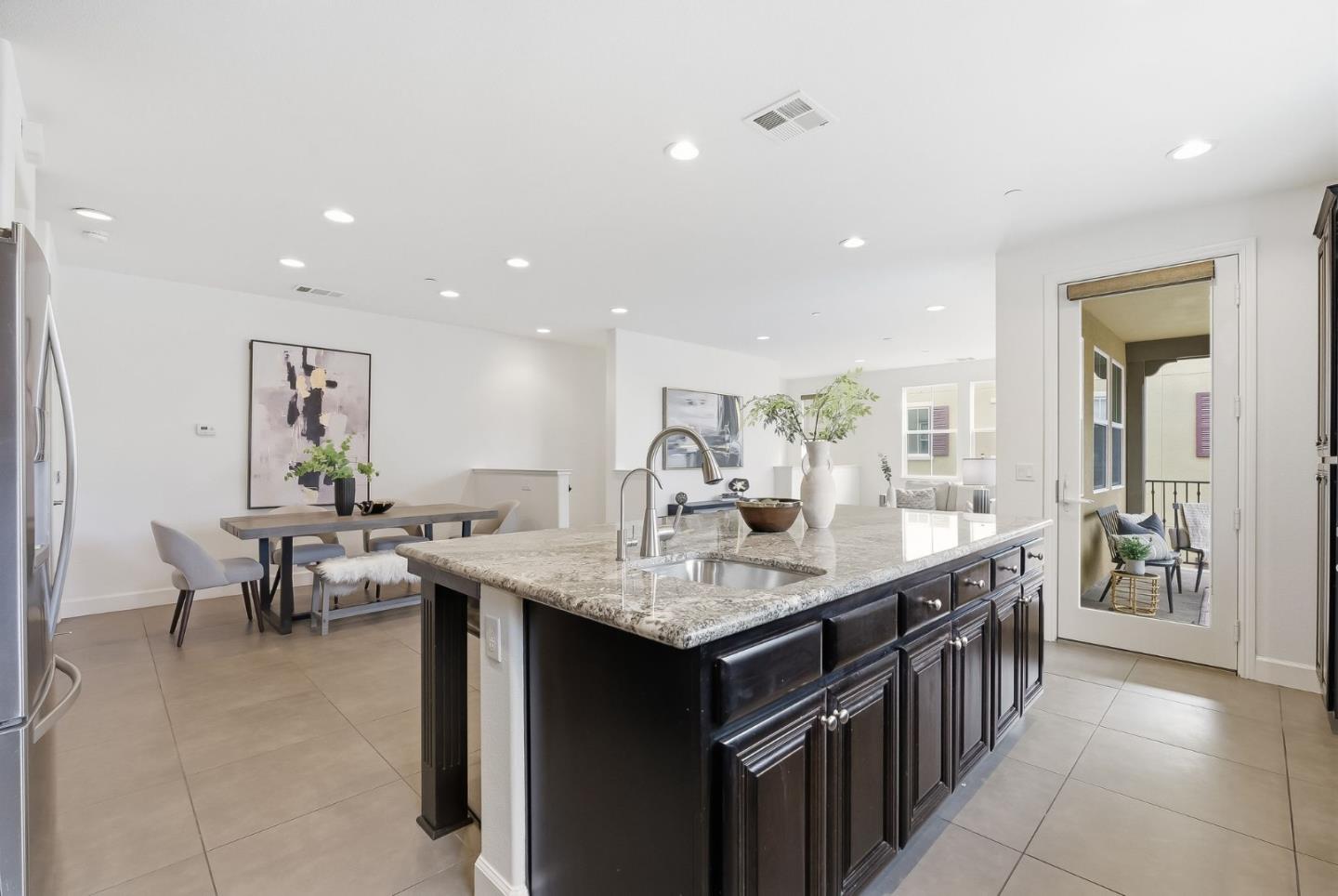 508 Holthouse Terrace Sunnyvale, CA 94087 - Photo 12 of 56 a living room with stainless steel appliances granite countertop furniture a counter top and chairs
