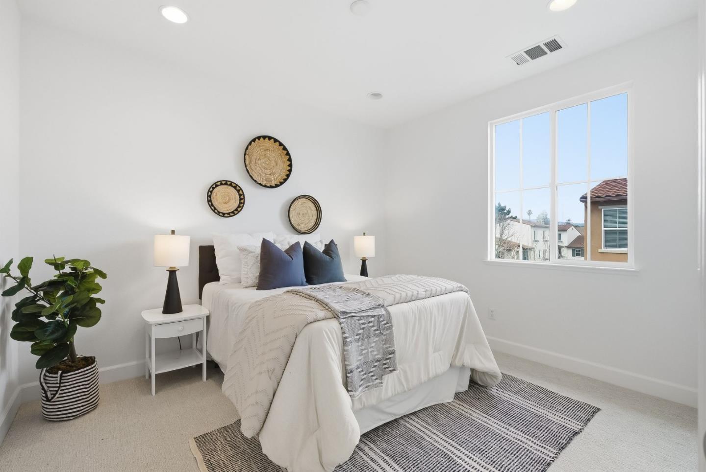 508 Holthouse Terrace Sunnyvale, CA 94087 - Photo 15 of 56 a bed room with a bed and a lamp
