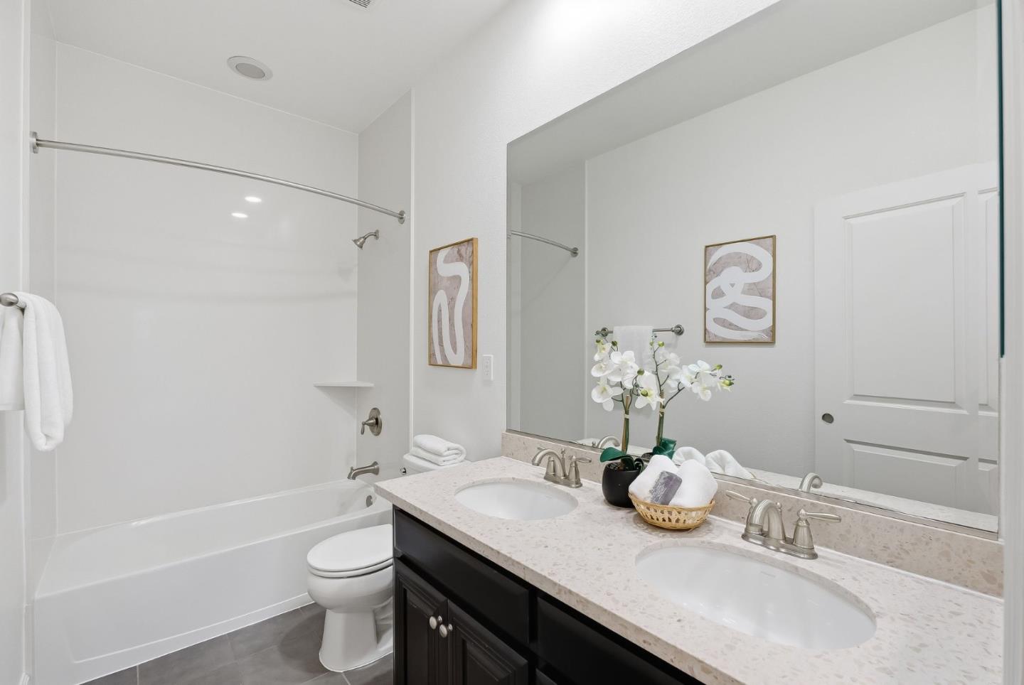 508 Holthouse Terrace Sunnyvale, CA 94087 - Photo 17 of 56 a bathroom with a granite countertop sink a toilet and bathtub