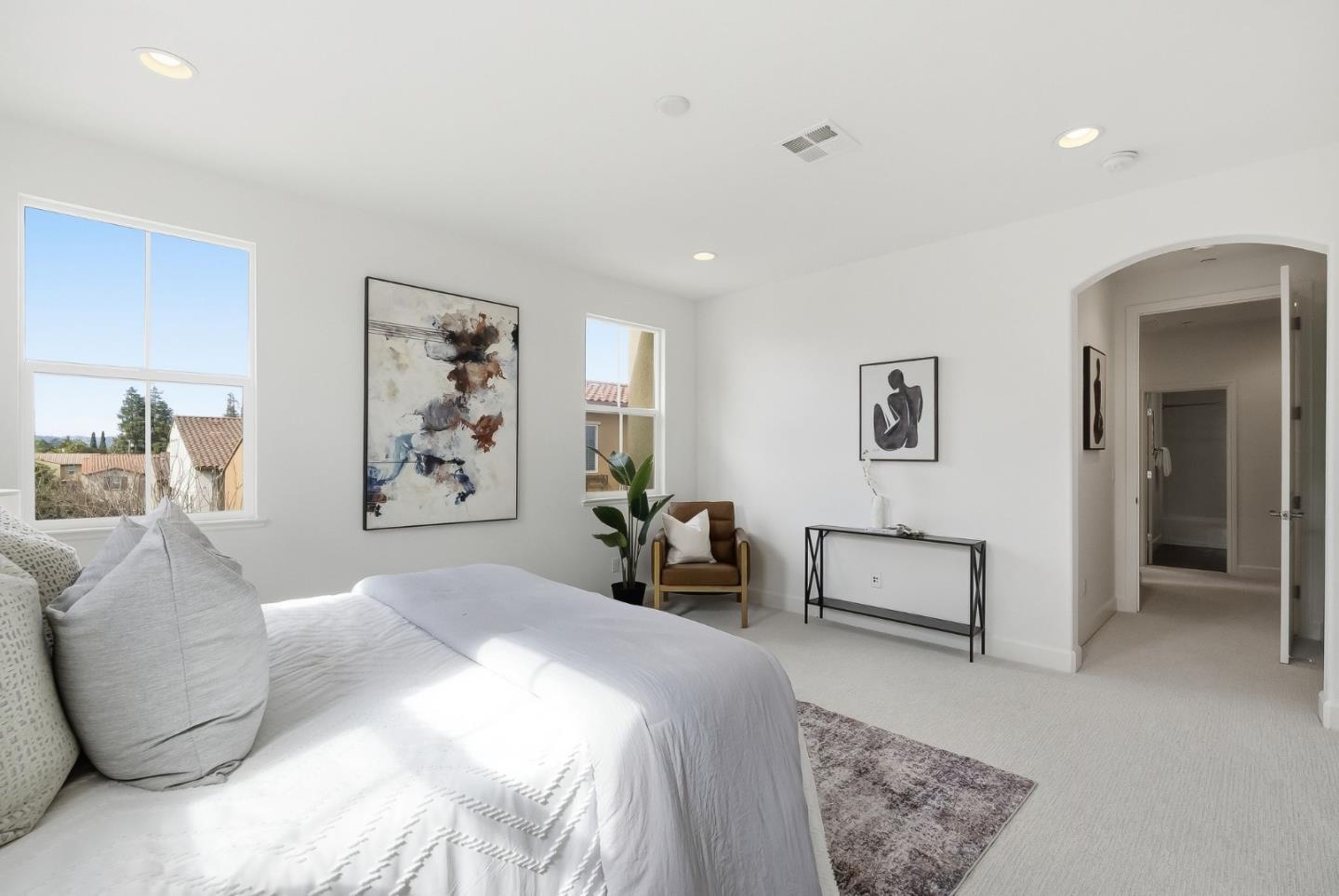 508 Holthouse Terrace Sunnyvale, CA 94087 - Photo 22 of 56 a bedroom with a large bed and a couch