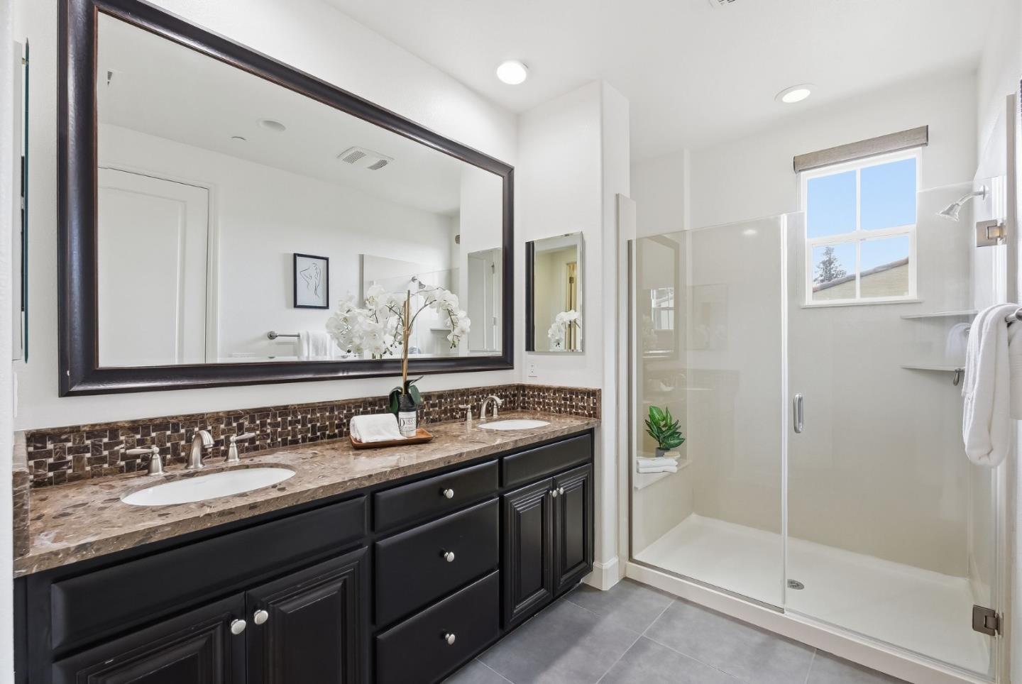 508 Holthouse Terrace Sunnyvale, CA 94087 - Photo 24 of 56 a bathroom with a granite countertop sink mirror and double