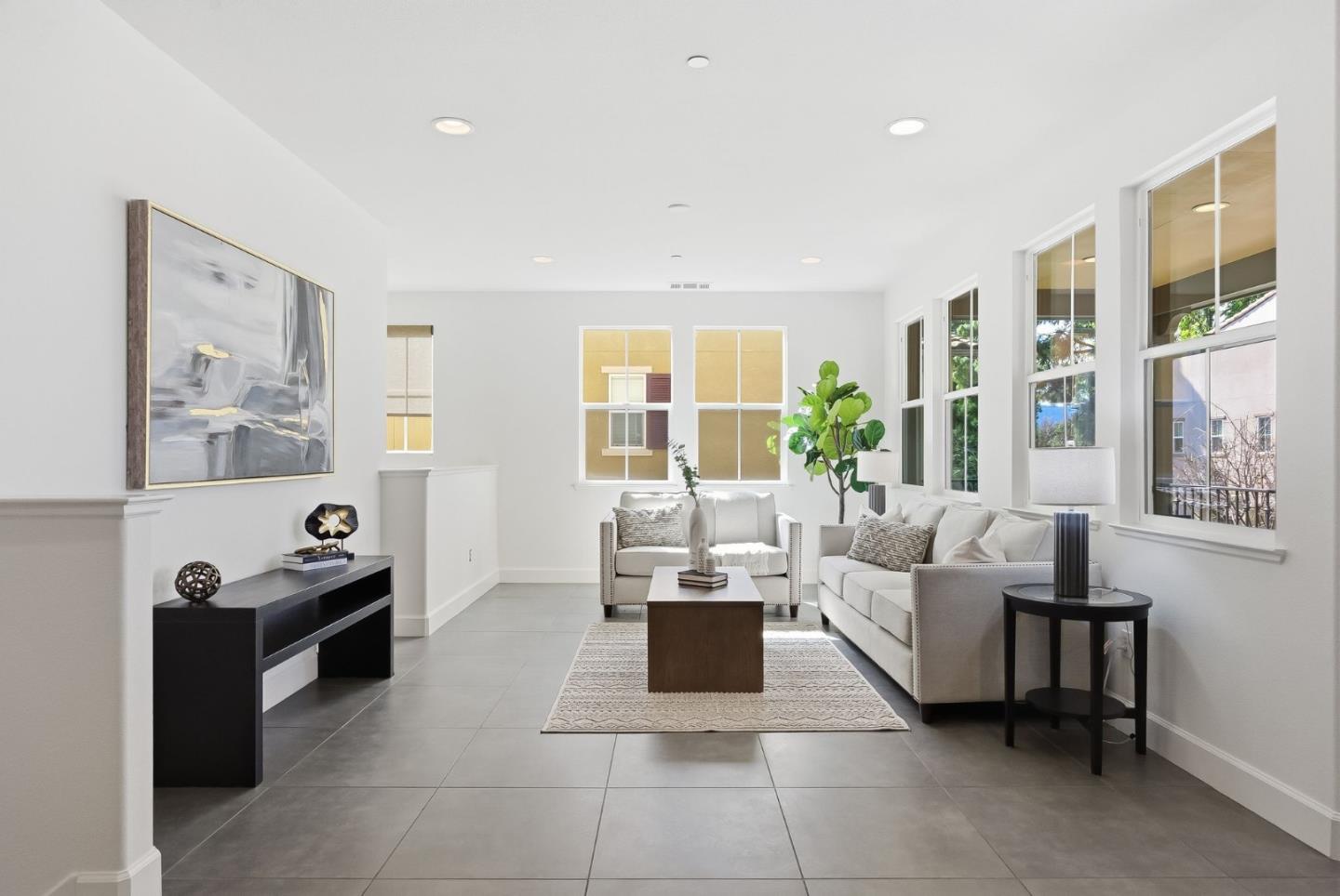 508 Holthouse Terrace Sunnyvale, CA 94087 - Photo 4 of 56 a living room with furniture and large windows