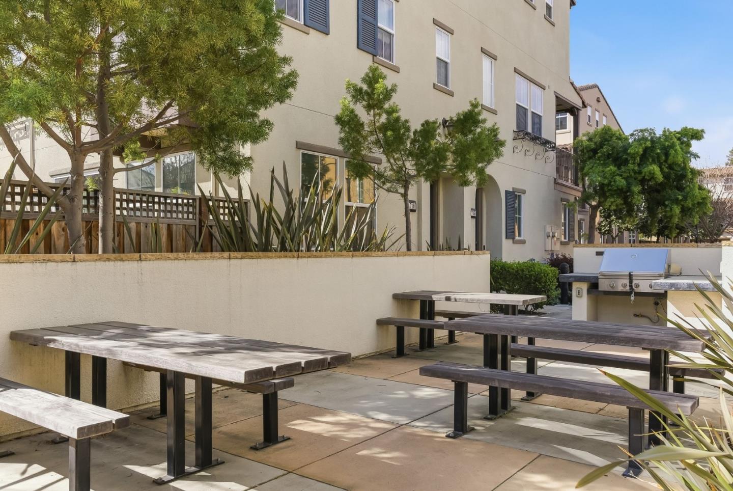 508 Holthouse Terrace Sunnyvale, CA 94087 - Photo 41 of 56 a view of a patio with table and chairs and potted plants