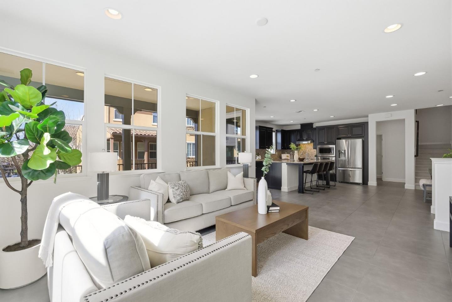 508 Holthouse Terrace Sunnyvale, CA 94087 - Photo 6 of 56 a living room with furniture and a potted plant