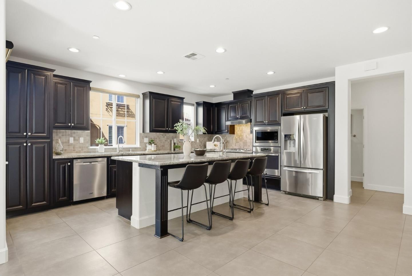 508 Holthouse Terrace Sunnyvale, CA 94087 - Photo 7 of 56 a kitchen with refrigerator and cabinets
