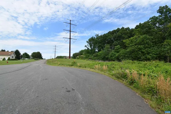 a view of a road with a yard