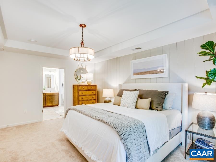 157 Lookover Terrace Stuarts Draft, VA 24477 - Photo 17 of 27 a bedroom with a bed and a chandelier