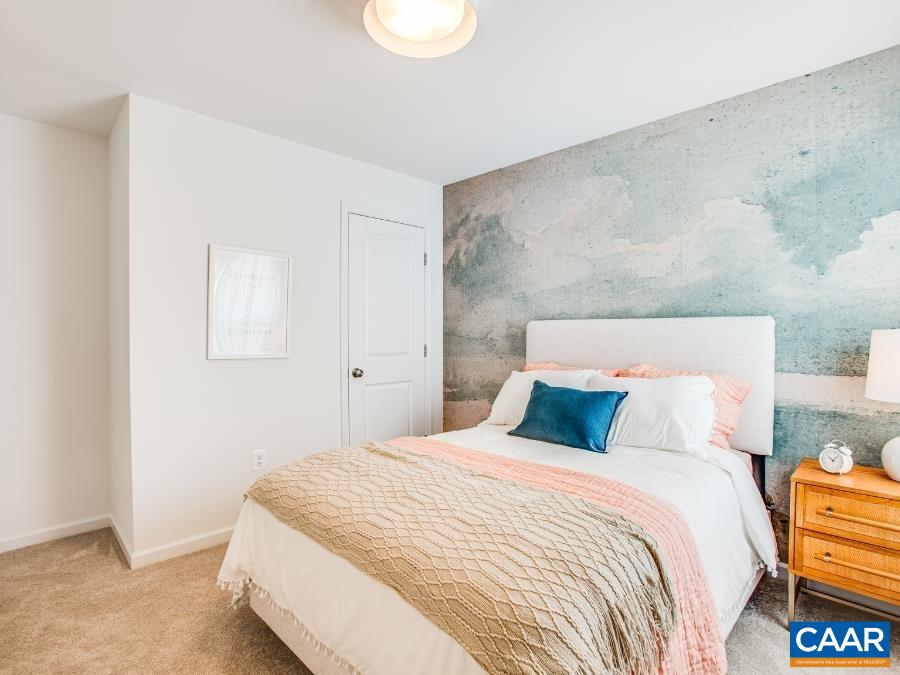157 Lookover Terrace Stuarts Draft, VA 24477 - Photo 21 of 27 a bedroom with a bed and a lamp