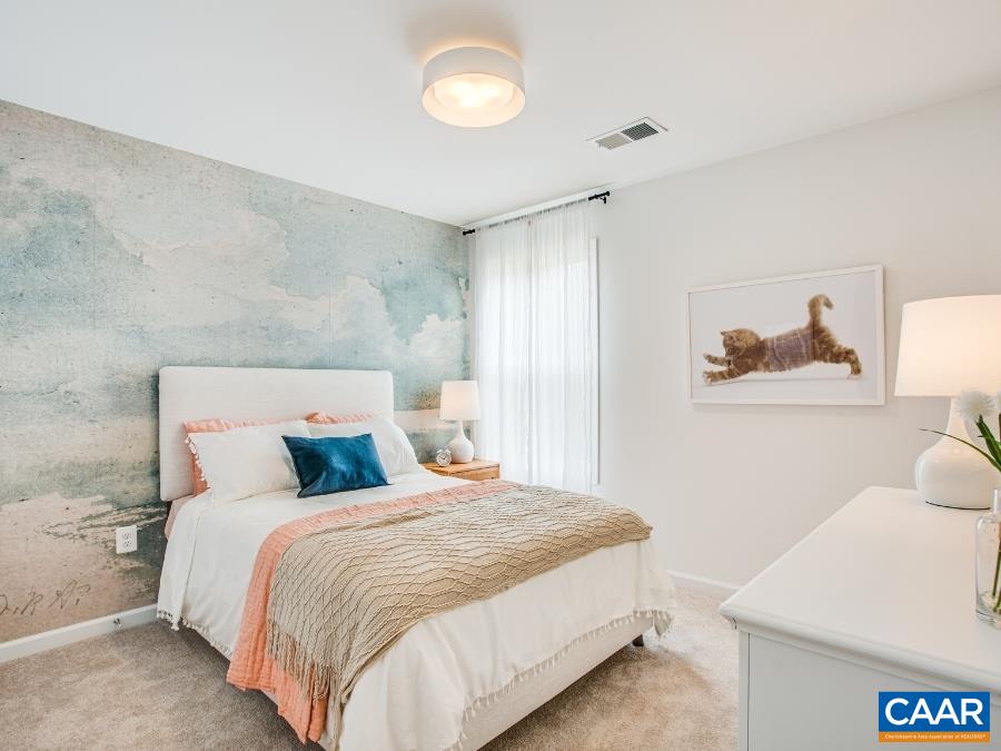 157 Lookover Terrace Stuarts Draft, VA 24477 - Photo 23 of 27 a bedroom with a bed and a lamp