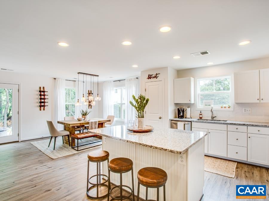 157 Lookover Terrace Stuarts Draft, VA 24477 - Photo 4 of 27 a kitchen with granite countertop white cabinets and stainless steel appliances