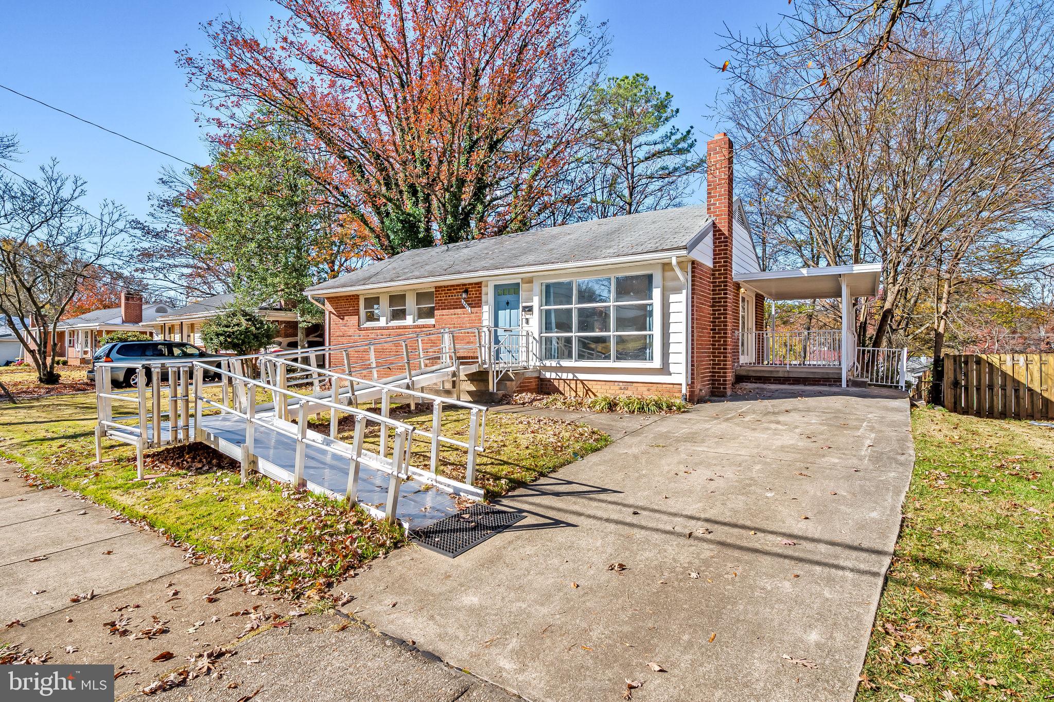 a view of a house with a patio and yard