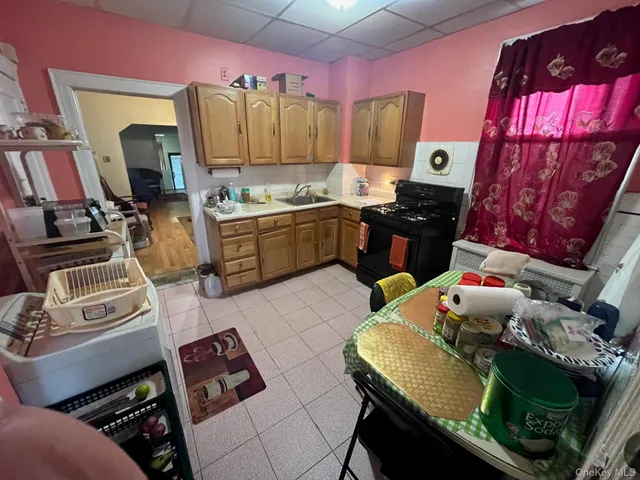 a kitchen with a stove and a refrigerator