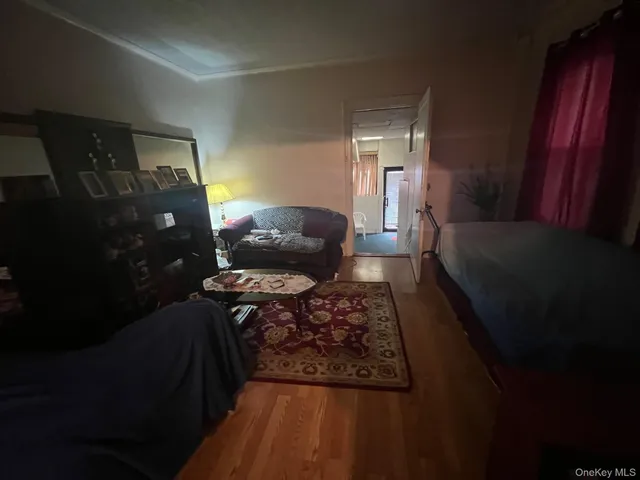 a living room with furniture and a lamp