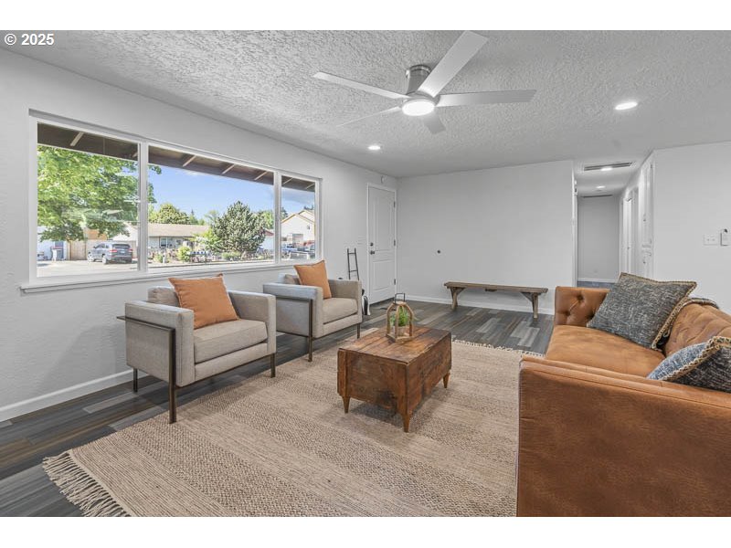 611 Northeast Bockes Loop Sheridan, OR 97378 - Photo 11 of 36 a living room with furniture and a large window