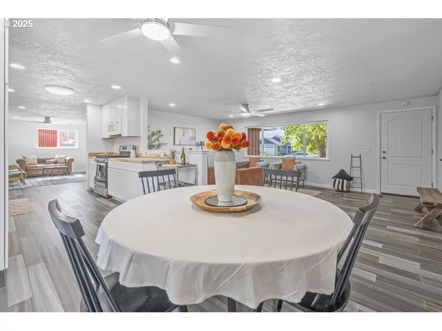 a dining room with furniture and window