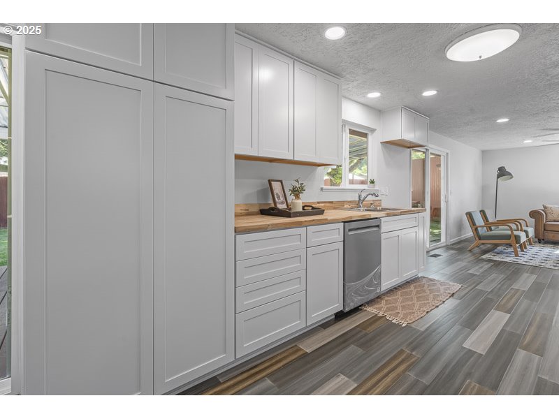611 Northeast Bockes Loop Sheridan, OR 97378 - Photo 14 of 36 a kitchen with a sink stainless steel appliances and cabinets