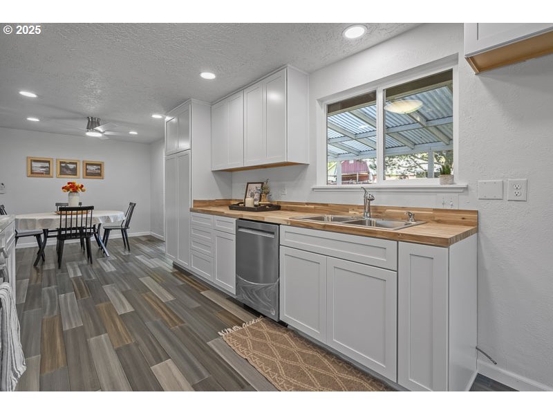611 Northeast Bockes Loop Sheridan, OR 97378 - Photo 18 of 36 a kitchen with a sink cabinets and wooden floor