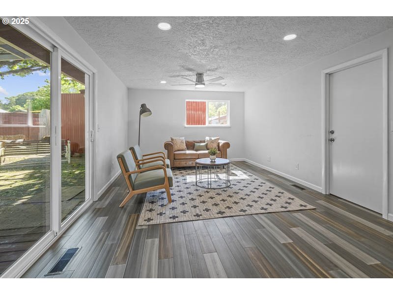 611 Northeast Bockes Loop Sheridan, OR 97378 - Photo 19 of 36 a living room with a couch and wooden floor
