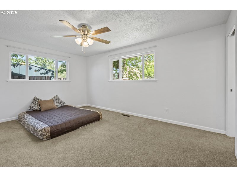 611 Northeast Bockes Loop Sheridan, OR 97378 - Photo 26 of 36 a living room with furniture and a chandelier
