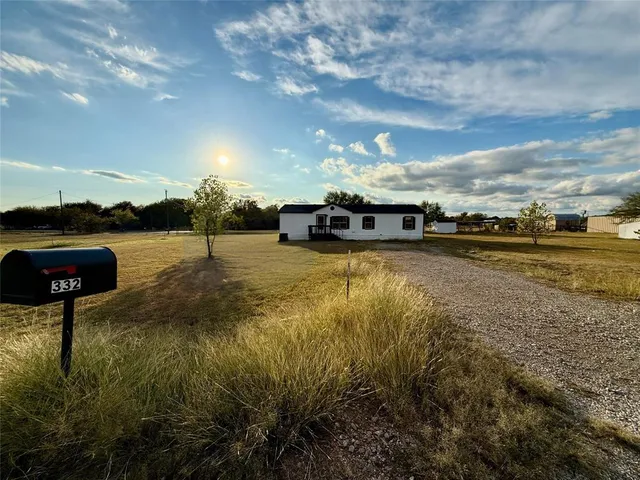 a view of a lake with houses in the back