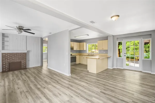 a view of kitchen with wooden floor and window
