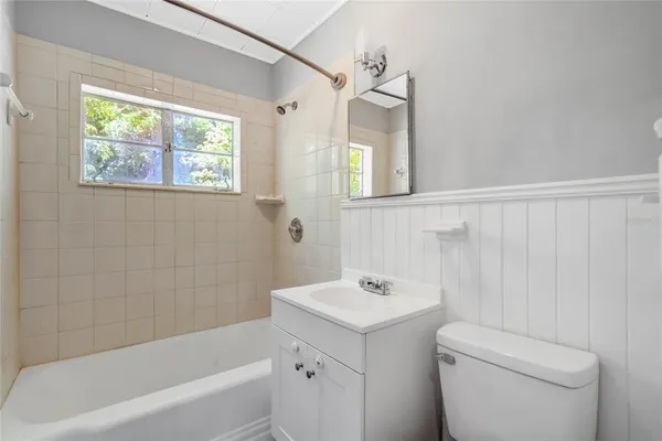 a bathroom with a sink a toilet and a bathtub