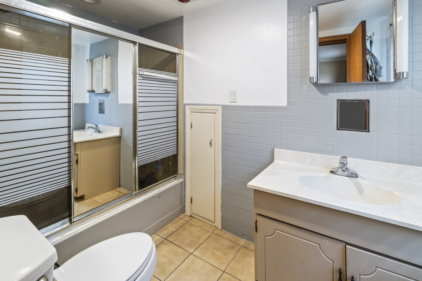 853 Orange Street Elgin, IL 60123 - Photo 12 of 28 a bathroom with a sink a toilet and shower