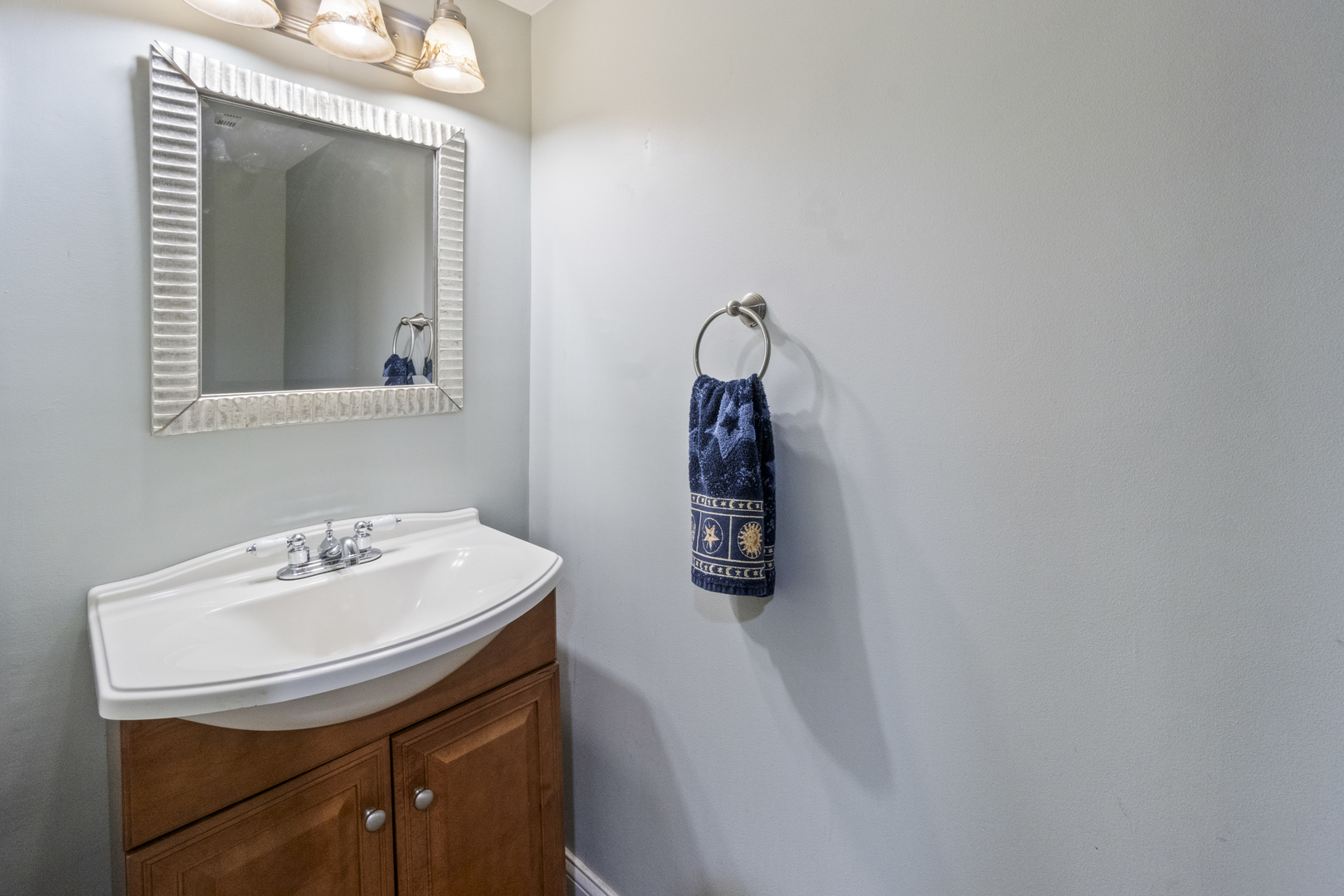 853 Orange Street Elgin, IL 60123 - Photo 18 of 28 a bathroom with a sink and a mirror