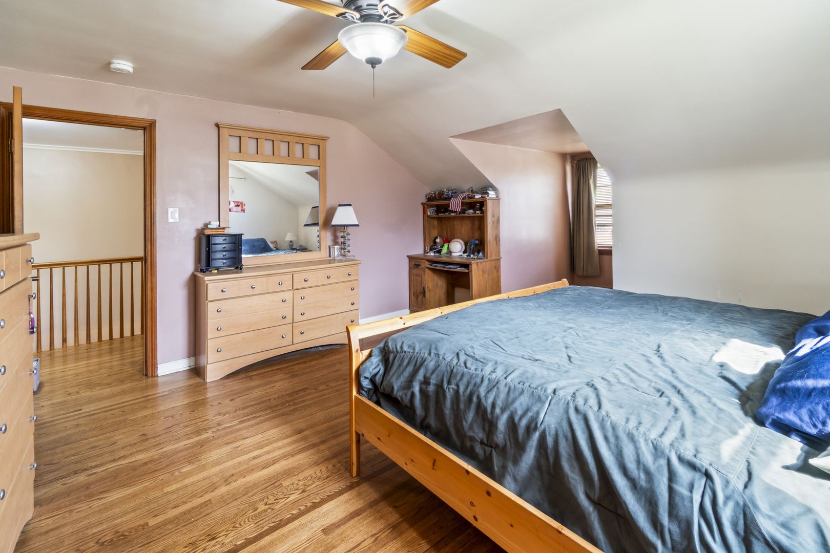 853 Orange Street Elgin, IL 60123 - Photo 9 of 28 a bed room with a bed and a chandelier