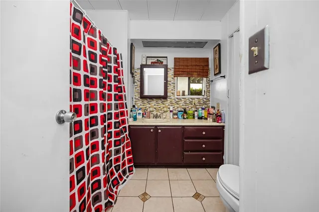 a bedroom with two beds and a window