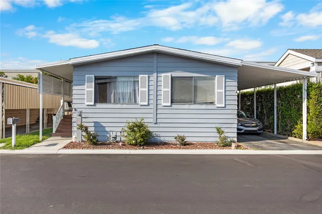 a yellow house with a outdoor space