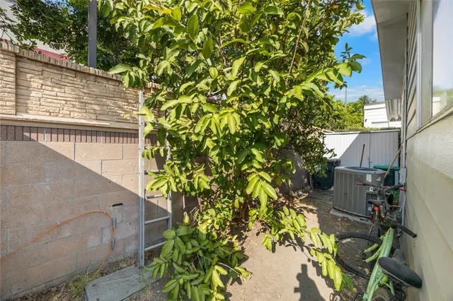 an aerial view of a house with a wooden fence