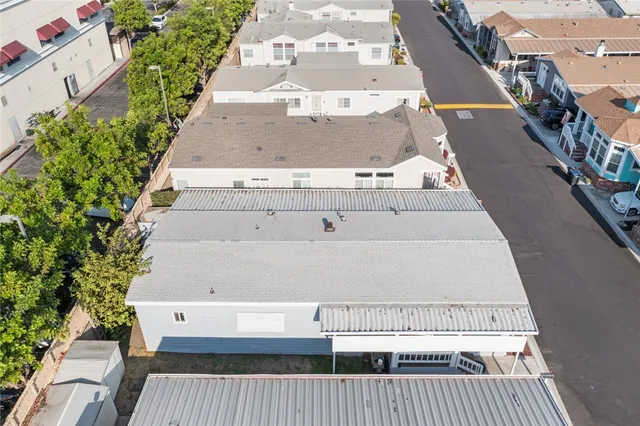 an aerial view of a house with a swimming pool outdoor seating and yard