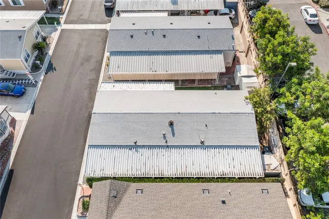an aerial view of a house with a garden and entryway