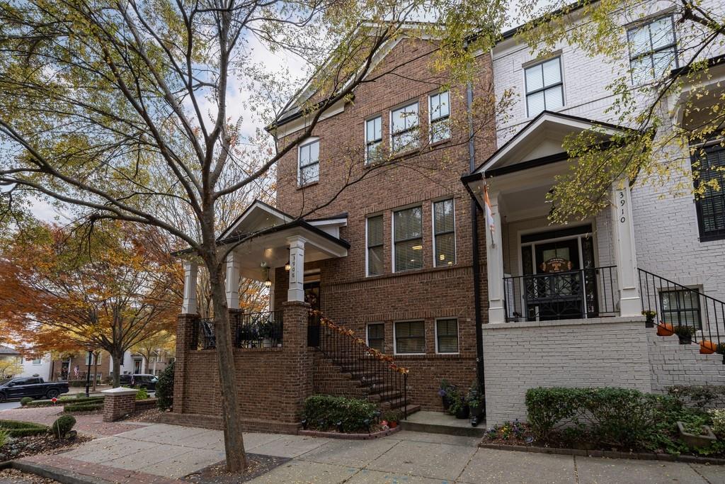3908 Charleston Market Street Northwest Suwanee, GA 30024 - Photo 1 of 58 a front view of a building with trees