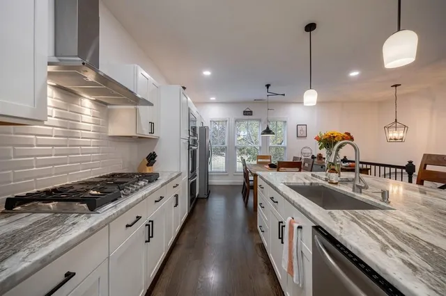 a view of a dining room and livingroom with furniture