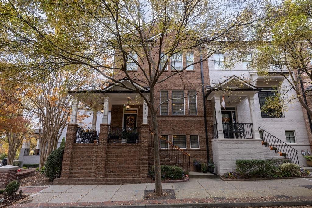 3908 Charleston Market Street Northwest Suwanee, GA 30024 - Photo 2 of 58 a front view of a building with street view