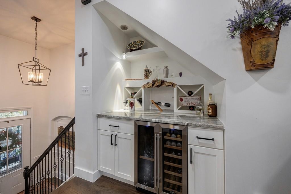 3908 Charleston Market Street Northwest Suwanee, GA 30024 - Photo 21 of 58 a kitchen with stainless steel appliances granite countertop a sink and cabinets
