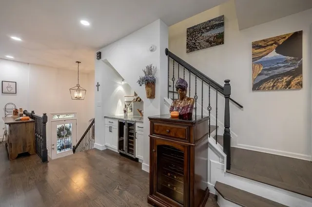 a large kitchen with a table and chairs