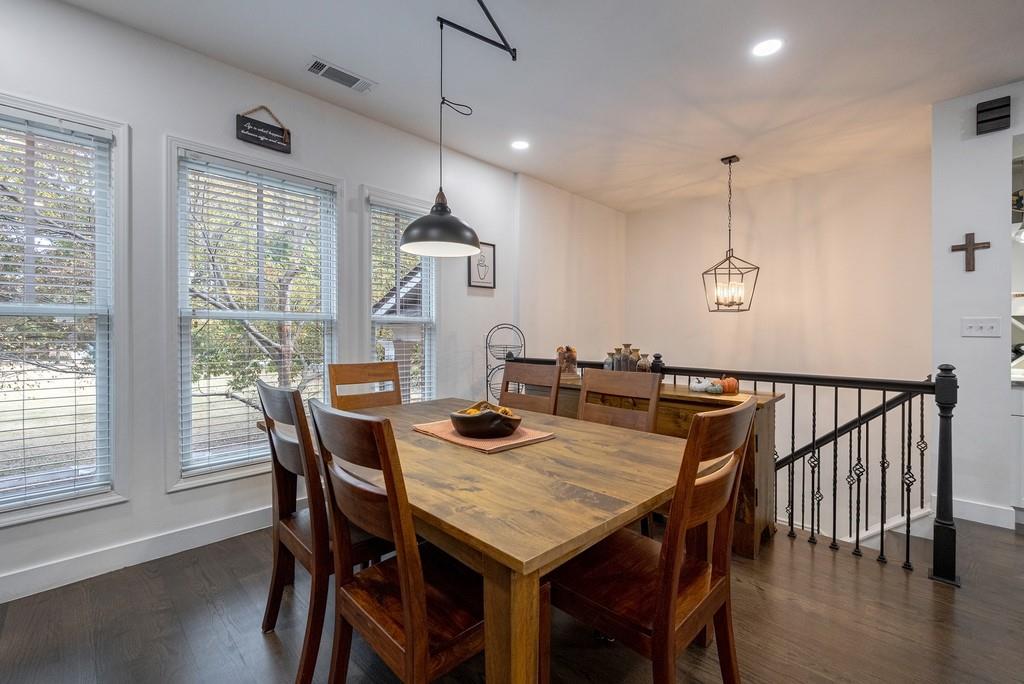 3908 Charleston Market Street Northwest Suwanee, GA 30024 - Photo 23 of 58 a view of a dining room with furniture window and wooden floor