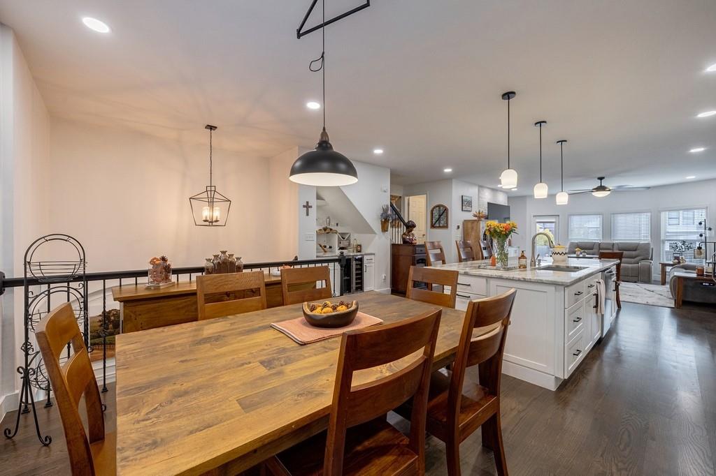3908 Charleston Market Street Northwest Suwanee, GA 30024 - Photo 24 of 58 a large kitchen with a table and chairs