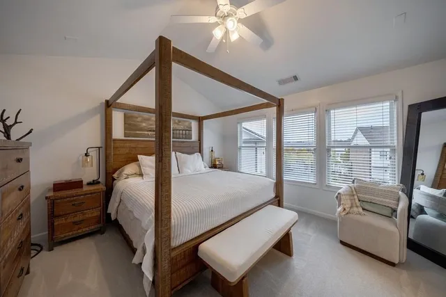 a bathroom with a tub a double vanity sink and a mirror