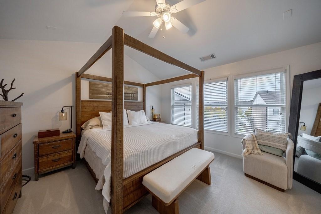 3908 Charleston Market Street Northwest Suwanee, GA 30024 - Photo 26 of 58 a bed room with a bed and a couch