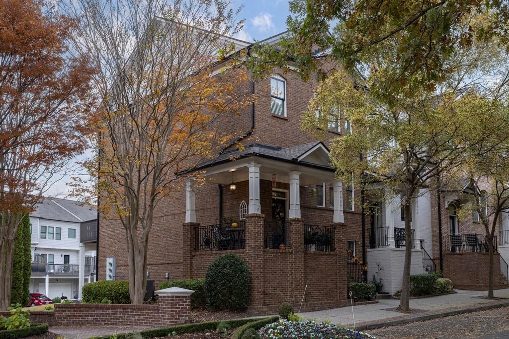 3908 Charleston Market Street Northwest Suwanee, GA 30024 - Photo 3 of 58 a front view of a house with a tree