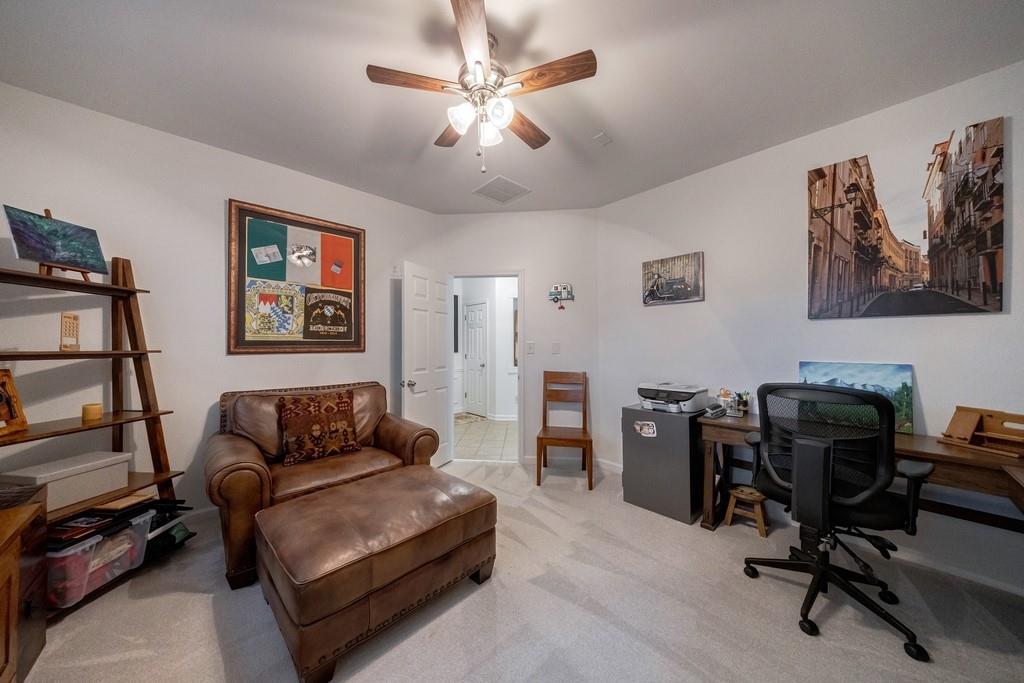 3908 Charleston Market Street Northwest Suwanee, GA 30024 - Photo 39 of 58 a view of a livingroom with workspace and a couch