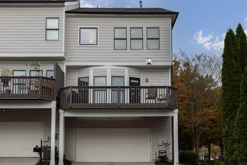 3908 Charleston Market Street Northwest Suwanee, GA 30024 - Photo 43 of 58 a view of a house with a balcony