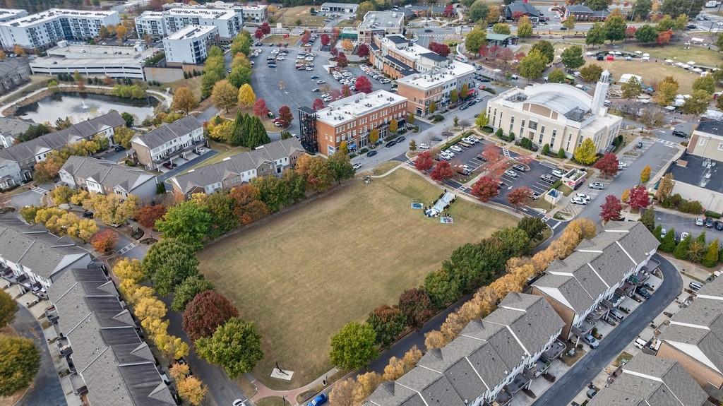 3908 Charleston Market Street Northwest Suwanee, GA 30024 - Photo 49 of 58 an aerial view of residential houses with outdoor space