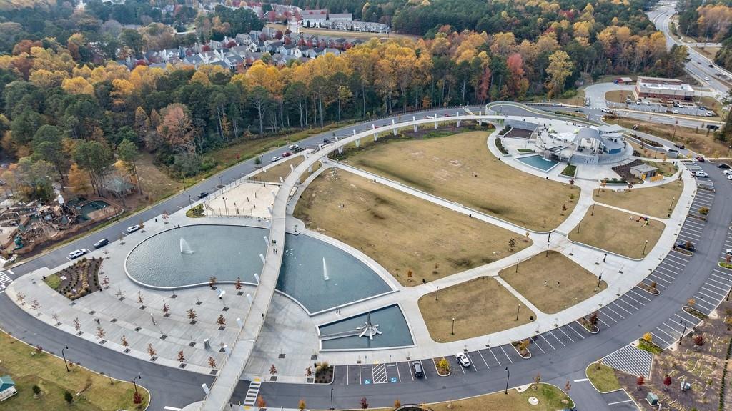 3908 Charleston Market Street Northwest Suwanee, GA 30024 - Photo 54 of 58 an aerial view of a house with swimming pool and lake view