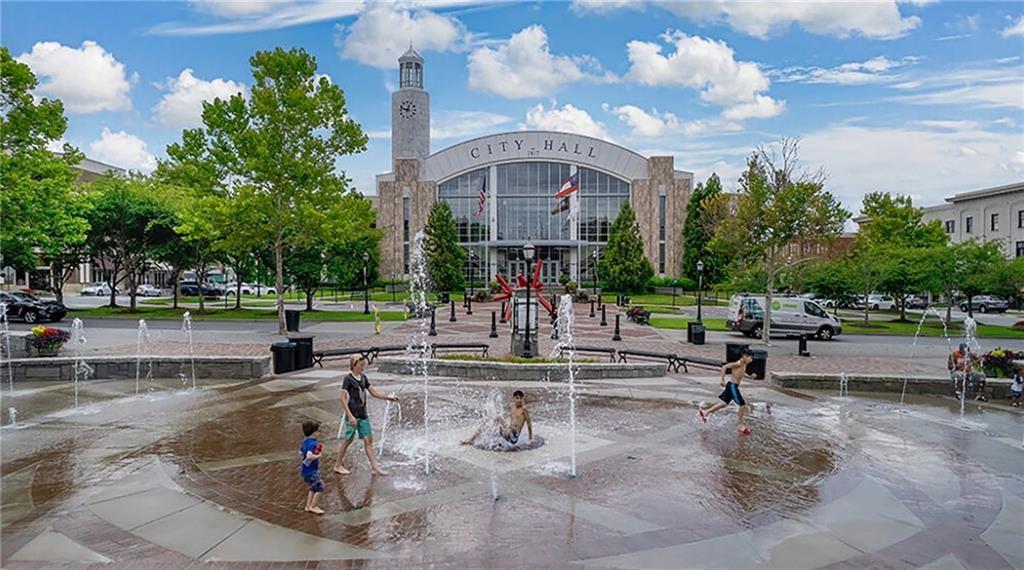 3908 Charleston Market Street Northwest Suwanee, GA 30024 - Photo 58 of 58 a view of a patio with a table and chairs